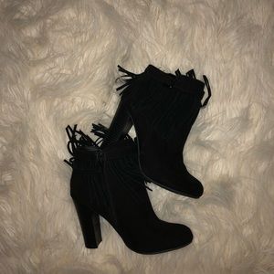 Material Girl black fringe heeled boots.